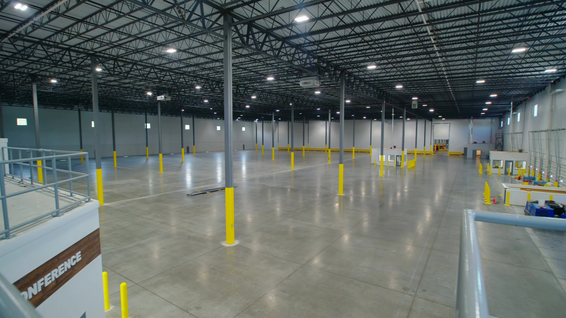 View across the warehouse floor from the Suite 101 mezzanine